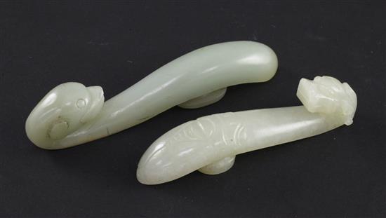 Two Chinese celadon jade belt hooks, 19th century, 11cm